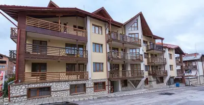 an apartment building with balconies on the side of it at ★ Chic & Elegant 1 Bedroom in Eagle's Nest Complex ★ Close to Gondola and Bar Street in Bansko