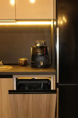 a kitchen with a tea kettle on top of a microwave at Kapana Luxury City Center Apartments with Garage in Plovdiv