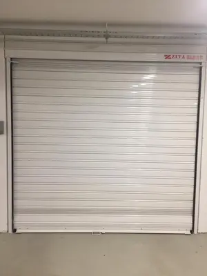 a closed garage door in a building at Kapana Luxury City Center Apartments with Garage in Plovdiv