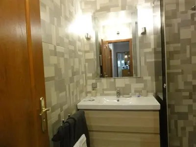a bathroom with a sink and a mirror at Apartment Sofia Center 2 in Sofia