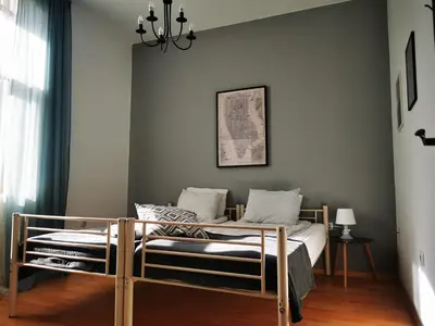 a bedroom with two beds in a room at Radomir Downtown Apartments in Radomir