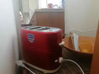 a red toaster sitting on top of a table at Пампорово апартамент,студио Милка 17,в х Росица, за ски и туризъм,целогодишно in Pamporovo