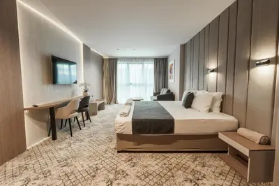 a hotel room with a bed and a desk at Medite Spa Resort and Villas in Sandanski