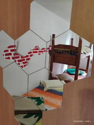 a childs bedroom with a giraffe pattern on the wall at хижа 