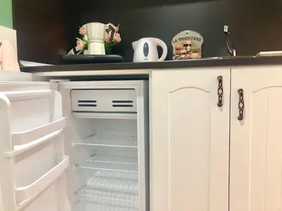 a refrigerator with its door open in a kitchen at Sofia centre in Sofia