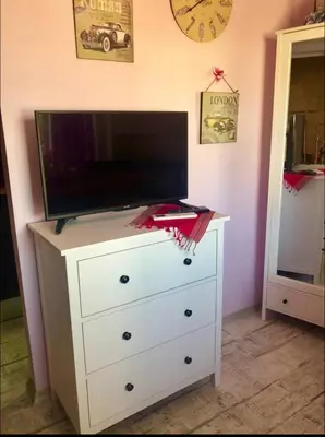 a white dresser with a tv on top of it at Sofia centre in Sofia