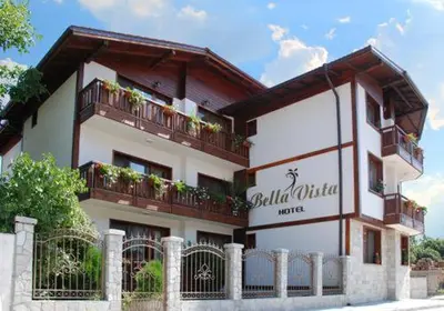 a building with a sign for a hotel at Bella Vista Guesthouse in Bansko
