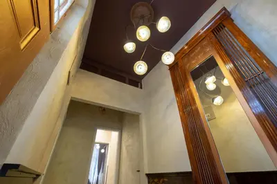 a room with a door and a chandelier at Temptation in Sofia - 24h Self Check-in in Sofia