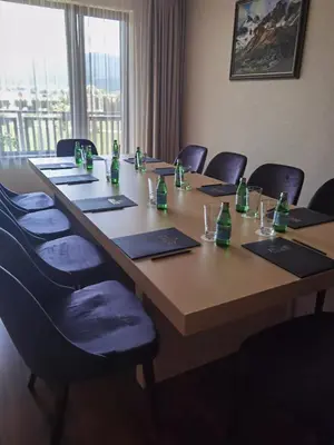 a conference room with a long table with chairs at Belchin Garden SPA&Wellness in Belchin