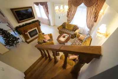 an overhead view of a living room with a fireplace at Ikonomov House in Bansko