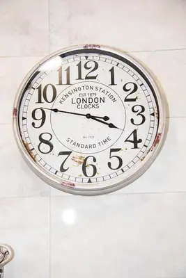 a clock is hanging on a wall at Studio Oslo byPMM in Plovdiv