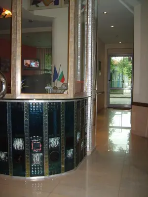 a lobby with a collection of records on the wall at Hotel Trakart Residence in Plovdiv