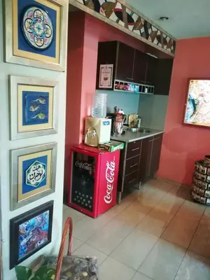 a kitchen with a coca cola refrigerator in a room at Hotel Trakart Residence in Plovdiv