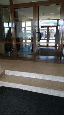 an entrance to an office building with glass doors at Ski Apartment D50 Cedar Lodge 4 in Bansko