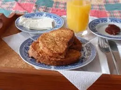 a table with two plates of food on a table at City Blagoevgrad Family Hotel in Blagoevgrad