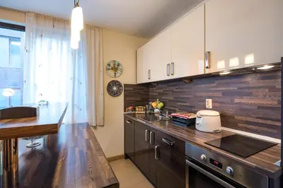 a kitchen with wooden countertops and a counter top at Mountain Escape Bansko 1BR apartment in Bansko