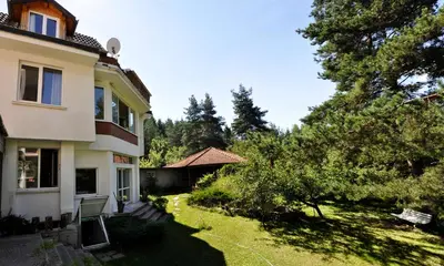 a view of a house with a yard at Strandzhata's House in Pasarel