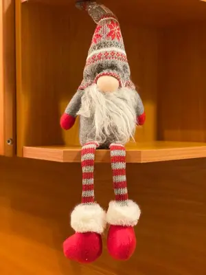 a santa claus doll hanging on a shelf at Aparthotel - Monastery 3, 1 Bedroom Apartment in Pamporovo