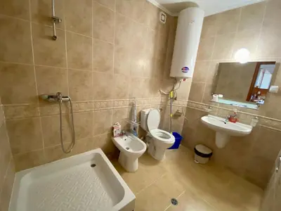 a bathroom with a toilet and a sink and a shower at Aparthotel - Monastery 3, 1 Bedroom Apartment in Pamporovo