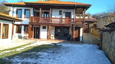 a house with snow in front of it at Боримечковата къща in Kalofer