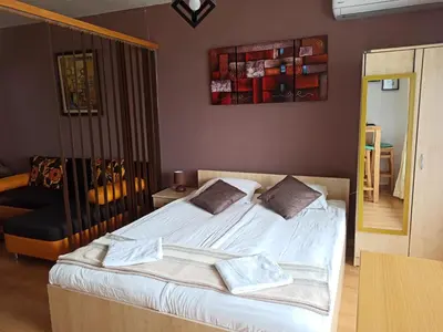 a bedroom with a bed with two pillows on it at F307 Studio Aspen Golf Resort Bansko in Bansko