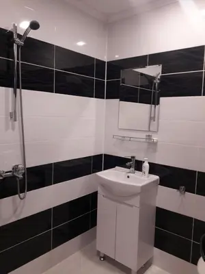 a bathroom with a sink and a mirror at Sharkova House Bansko in Bansko