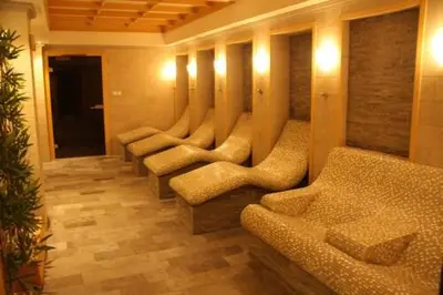 a row of chairs in a room with lights at 7 Pools SPA Boutique Hotel in Bansko