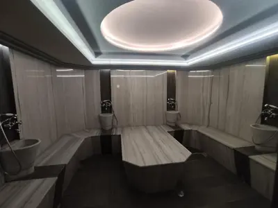 a bathroom with two toilets and two sinks at 7 Pools SPA Boutique Hotel in Bansko