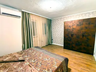 a bedroom with a bed and a large closet at Venice Apartments in Sofia