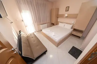 a small room with a bed and a couch at Villa Drecheva in Ognyanovo