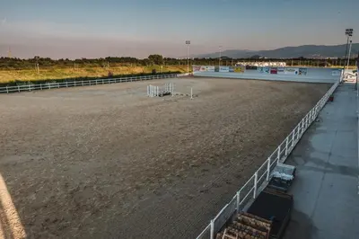 a large arena with a fence and a track at Hotel Frigopan in Plovdiv