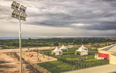 a view of a playground with white tents at Hotel Frigopan in Plovdiv