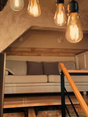 a living room with a couch and lights at Boutique Guest House Yes For You in Plovdiv