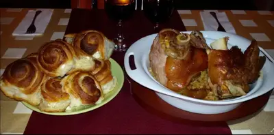 two plates of pastries and a bowl of food on a table at Guest House Ilinden in Bansko