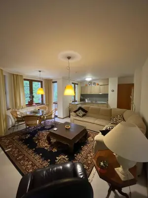 a living room with a couch and a table at HQ apartments Villa Park in Borovets
