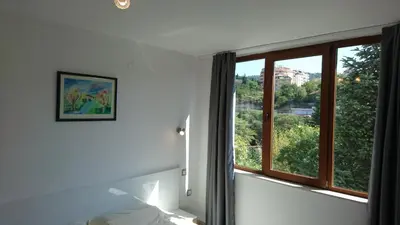 a room with a window with a view at Park Apartments & Rooms Popovi in Sandanski