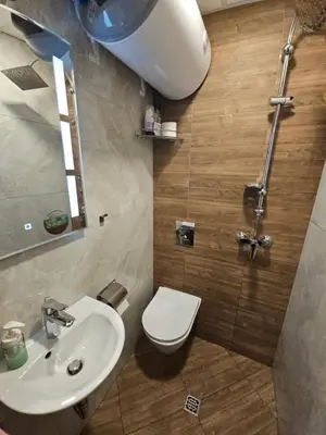 a bathroom with a toilet and a sink at Hot Spot Studio in the center in Sofia