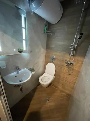 a bathroom with a toilet and a sink at Hot Spot Studio in the center in Sofia