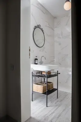 a white bathroom with a sink and a mirror at Beautiful best location apartment 