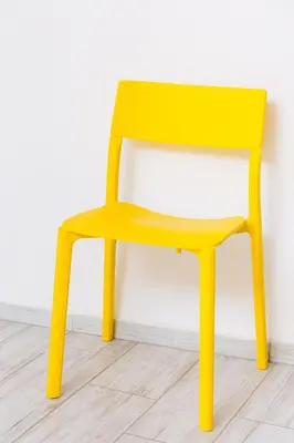 a bright yellow chair sitting in a room at Beautiful best location apartment 