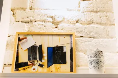 a framed picture of a person with a laptop at Beautiful best location apartment 