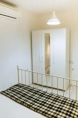 a room with a staircase with a mirror and a rug at Beautiful best location apartment 