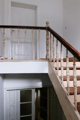 a stair case in a house with a white staircase at Beautiful best location apartment 