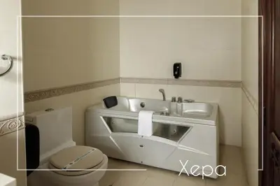 a bathroom with a sink and a toilet at Boutique & Spa Hotel Heaven in Velingrad