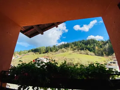 a view of a mountain from a window at Family Hotel Savov in Chepelare