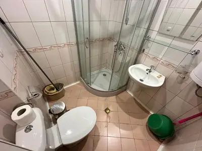 a bathroom with a shower and a toilet and a sink at Ramada 2 - Apartment in Bansko