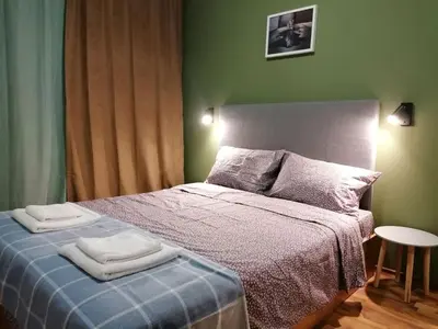 a bedroom with a bed with two towels on it at Ramada 2 - Apartment in Bansko