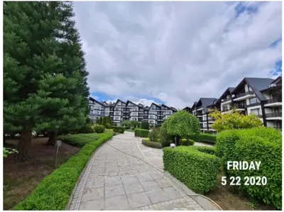 a walkway in front of a apartment complex at Studio L006 in Aspen Golf in Bansko