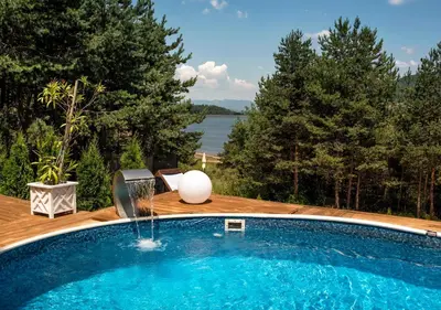 a swimming pool with a egg sitting on top of it at Guest House Slunchev Cviat in Tsigov Chark