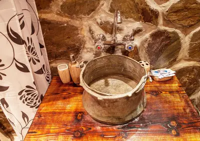 a bathroom with a large metal tub with a sink at Villa Mark in Kraevo